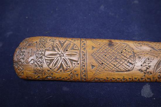 An 18th century treen stay busk dated 1770 and initialled SL length 30cm